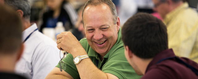 Person laughing while talking to another person